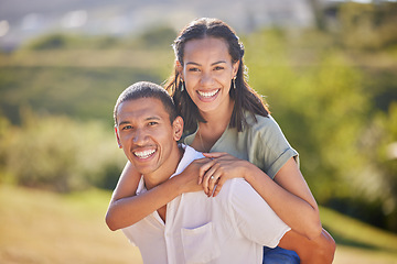 Image showing Portrait, piggyback and happy couple in nature on a romantic date, vacation or walk in green garden. Love, care and smile of a husband and wife bonding in an outdoor park while on a summer holiday.