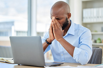 Image showing Stress, anxiety and tired businessman with a laptop suffering from burnout while frustrated, fail and mistake in the office. Entrepreneur suffering from headache with a deadline working at a desk