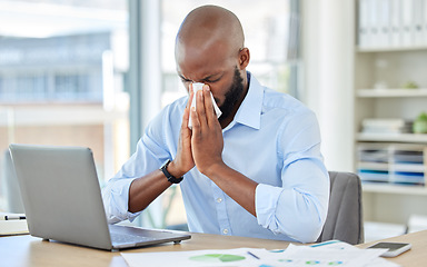 Image showing Black man, covid and flu in office by laptop, desk or research documents in company. Sick businessman or worker blowing nose with tissue, suffering from healthcare virus and medical wellness crisis