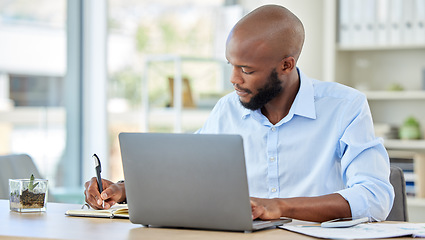 Image showing Planning notebook, laptop and businessman working online idea, brainstorming or project management at an office desk. Productive corporate black man writing website ecommerce or tech finance strategy