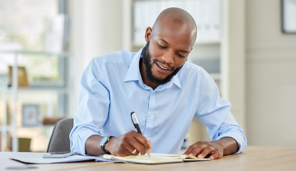 Image showing Businessman writing in a notebook while planning a strategy and working in an office. Happy male professional reading and write market search result and work updating schedule at a corporate company