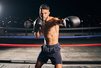 Image showing Boxing ring, exercise and man or boxer in gym training for fitness, fight or workout. Sport, wellness and health with male fighter or athlete in sports club ready to train for tournament or match.