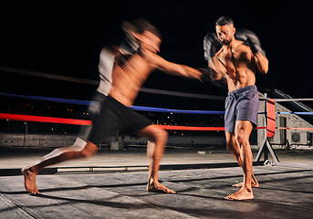 Image showing Boxing ring, boxer match and sports men energy in dark arena competition or extreme tournament battle with gloves movement. Fast player in fitness boxing or wrestling workout training in wellness gym