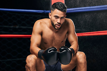 Image showing Fitness, motivation and boxing man in competition ring fight at wellness gym for health exercise, training and workout. Background portrait of tired boxer with vision, winner mindset or sports goals