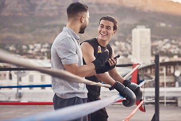 Image showing Boxing ring, strong men at outdoor gym talking fight strategy for fitness motivation, coaching goal with personal trainer. Professional boxer team people or wellness workout friends in extreme sports