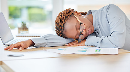 Image showing Sleeping, tired or burnout black woman in finance office with desk laptop or infographic documents. Exhausted, overworked or depression for accounting compliance employee in financial audit business