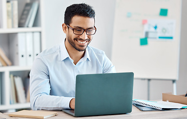 Image showing Business man typing on laptop, research or working on marketing, accounting or data. Corporate person, on computer or reading, writing email or planning a finance project in the office with a smile