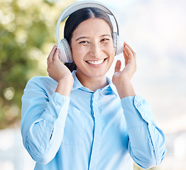 Image showing Music, listening and headphones with a woman using bluetooth to listen to a podcast, radio or audio outside with a smile. Portrait of a happy young female streaming with a subscription service