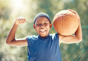 Image showing Child, basketball and fun with strong black boy holding a ball and ready to play outside for fitness hobby, health and wellness. Flexing muscles, happy childhood and practice with child playing sport