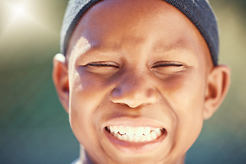 Image showing Children, face and teeth with a black boy outside with a big smile and eyes closed. Kids, head and joy with a carefree little male child standing outdoors alone with flare and a positive expression