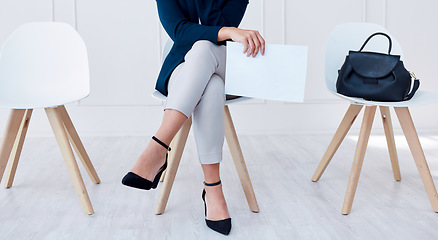 Image showing Business woman in waiting room for recruitment, we are hiring or Human Resources with CV, resume or contract paper. Shortlisted person at corporate interview for job or career opportunity in HR