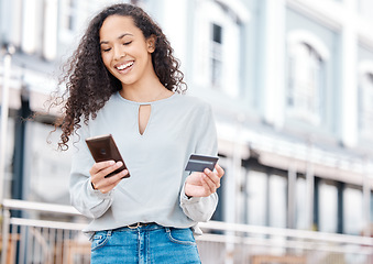 Image showing Fashion woman, phone and ecommerce online shopping in city with fintech, e commerce app and credit card. Smile, happy and relax person on building background paying for trend clothes on finance tech