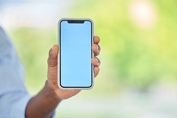 Image showing Phone, blue screen and mockup space for marketing, company website and advertising brand. Zoom on worker, hand or businessman with startup logo, internet digital search or social media app background