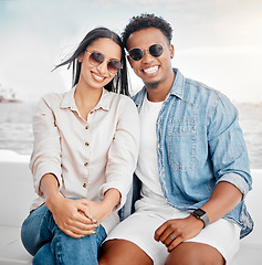 Image showing Sunglasses, summer and couple portrait at the beach for holiday, vacation with casual fashion style. Gen z or millennial woman, man or people smile together with ocean, sea and clear sky mock up