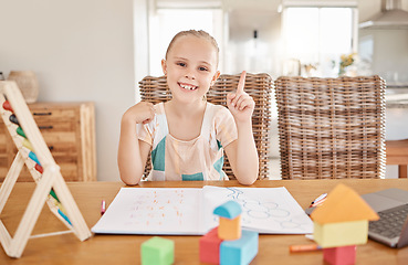 Image showing Education, learning and child development with girl drawing and doing homework at a kitchen table at home. Portrait of a happy student smile, enjoying distance learning and educational art project