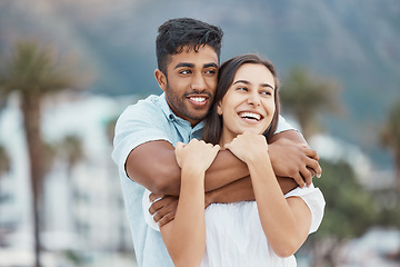 Image showing Couple, love and smile while hugging and enjoying their vacation, holiday and free time together while sharing a laugh, joy and commitment. Happy man and woman enjoying view and healthy relationship