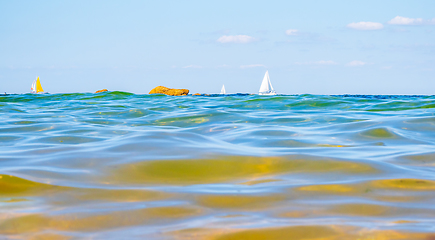 Image showing Sailing boats and waves seen by a swimmer at sea level, photogra