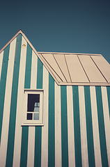 Image showing Little blue and white striped tiny house. Photography taken in F