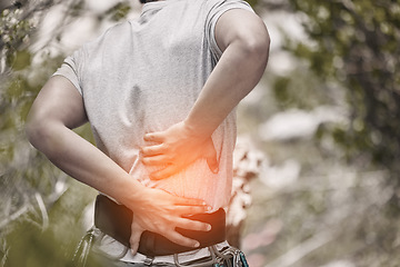Image showing Back, pain and injury with sports man hiking in nature and suffering from a medical emergency with overlay, special effects and cgi. Anatomy, physical and muscle inflammation with a male athlete