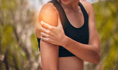 Image showing Hand, pain and injury with a sports woman holding her arm and shoulder with overlay outside for exercise, health and fitness. Training and workout cgi with a female athlete suffering with body hurt