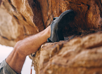 Image showing Leg of man climbing rock, mountain or stone for workout, adventure or exercise. Bouldering, sport and fitness of male climber training outside, countryside or nature mountaineering, hiking or climb.