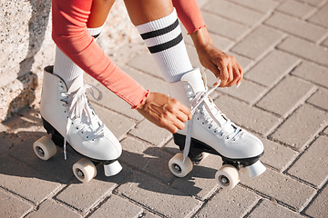 Image showing Roller skate shoes, woman tying laces and fun summer fitness activity, holiday workout and urban lifestyle outdoor. Gen z, girl and youth ready to start skating, travel and healthy wellness exercise