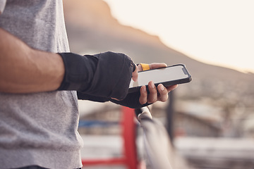 Image showing Gym man, typing and phone screen at boxing fitness training practice for text conversation break. Athlete with a 5g, connection and communication tech at an outdoor sports workout venue.