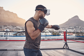 Image showing Virtual reality, boxing and sports man training for fight, fitness or exhibition competition in a boxing ring. Vr headset or goggles, metaverse and boxer workout with exercise innovation gamer tech