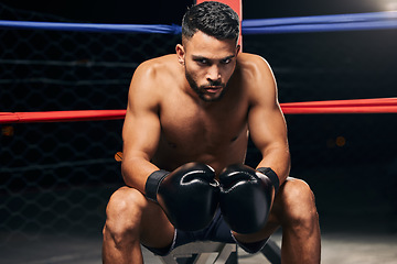 Image showing Boxing ring man, strong power and focus mma fighter ready to punch, hit and challenge competition champion in gym club, exercise and training. Fitness portrait, boxer gloves impact and sports athlete