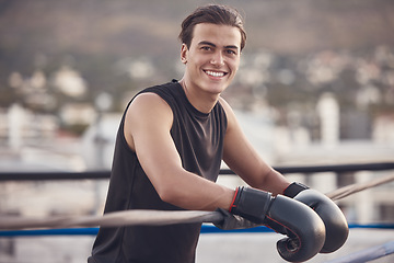 Image showing Boxing ring, gloves and man portrait for fitness vision, motivation or a happy workout training outdoor. Smile of young boxer in mma wrestling sports for wellness exercise, health and strong muscles