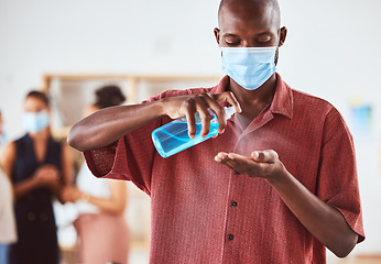 Image showing Covid, hand sanitizer and business man with face mask at business meeting for healthcare safety, risk management and compliance. Covid 19, corona virus and policy black man with spray bottle cleaning