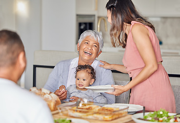 Image showing Family, grandmother and baby with food at the dining room or kitchen table for mothers day. Happy mother, father and grandma playing with newborn child with mother day lunch celebration or birthday