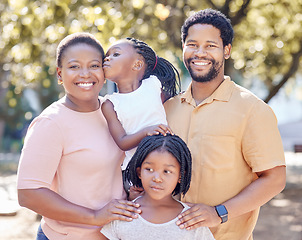 Image showing Black family, outdoor fun and smile of parents bonding and spending free time with their children on a sunny day. Portrait of happy man and woman standing in a park or nature with their cute girls