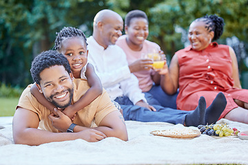 Image showing Black family, picnic and father bonding with girl in nature park and public garden. Portrait of smile, happy or fun man with small child, grandparents and seniors in reunion for health food and drink