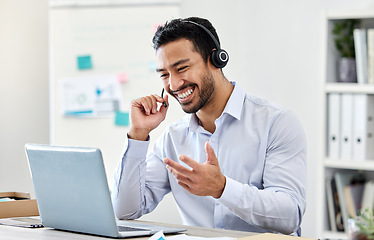 Image showing Asian man, laptop or call center worker in communication, customer service or contact us support office. Smile, happy and excited crm consultant or telemarketing receptionist on tech sales consulting