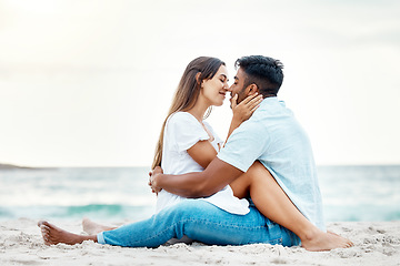 Image showing Kiss couple, beach love and happy honeymoon, travel and summer relaxing at seashore together. Romantic man, smile woman and young people on ocean vacation, intimate holiday and quality time date