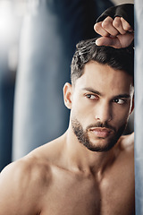 Image showing Fitness, exercise and boxing training by tough man boxer thinking and planning his strategy before a match. Young, athletic and handsome Mexican looking cool and serious, ready for physical challenge