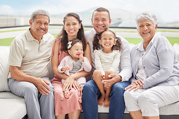 Image showing Portrait of a family on vacation outdoors, happy and smiling while bonding with their grandmother and grandfather. Cheerful children having fun with their parents and grandparents on weekend