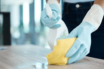 Image showing Cleaning, spray bottle and hygiene with woman with gloves for housekeeping, service or disinfectant on table surface. Housekeeper, maid or housewife and cleaner, sanitary and wash at home