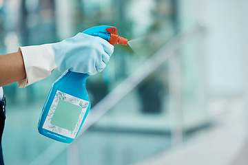 Image showing Covid, cleaning and sanitizing with the hands of a woman cleaner in gloves holding a spray bottle to clean and wash an office with sanitizer. Hygiene, spraying and washing with an alcoholic liquid