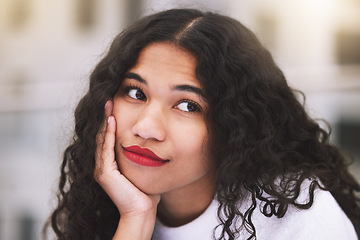 Image showing Face, thinking and woman by woman relax against an urban background, waiting in the city. Young mexican female daydreaming and planning on fun things to do on a trip downtown, bored and carefree