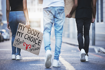 Image showing Global, freedom and protest march for abortion rights with board sign and activism in a street in urban city. Pro choice, pro abortion and female empowerment posture with crowd fighting for change