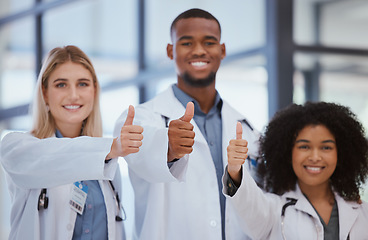 Image showing Thumbs up, hands and doctors in hospital success with thank you, winner or trust in medical wellness. Happy smile portrait, gesture or diversity teamwork collaboration of healthcare insurance worker