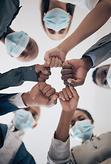 Image showing Fist, covid face mask or business people unity, teamwork compliance or collaboration to stop global bacteria. Zoom on worker hands or office women in support, trust or motivation against corona virus