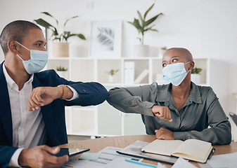 Image showing Covid face mask and business people in meeting with elbow greeting, teamwork and collaboration together in the workplace or office. Corporate workers with motivation planning strategy in corona virus