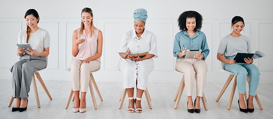 Image showing Business women multimedia planning for recruitment, career goal and creative marketing strategy with diversity. Corporate people with notebook, smartphone and document in a job interview waiting room