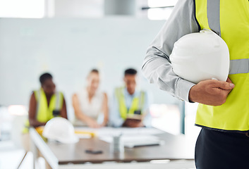 Image showing Man, building helmet and construction worker meeting with engineering leadership, manager and employee. Zoom on hand, safety hard hat and architect with property vision for real estate architecture