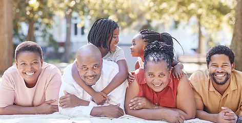 Image showing Nature, garden and portrait of a happy black family relaxing together while on summer vacation. Smile, park and positive african people on a picnic outside while on a holiday in the countryside.