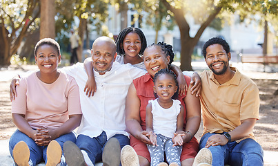 Image showing Happy portrait of a black family in nature with mother, grandparents and children smiling next to father. Mom, dad and kids love quality time with senior African woman at a park in summer on holiday