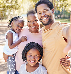 Image showing Happy black family take a selfie in nature on a holiday vacation trip together enjoy quality time at a kids park. Smile, happiness and African girls love taking pictures with their mother and father